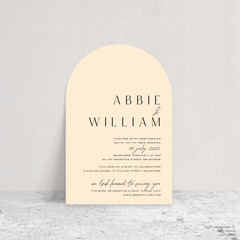 Arch shape flat lay of Abbie wedding invitation with clean, elegant layout and timeless typography, styled with a minimalist aesthetic.