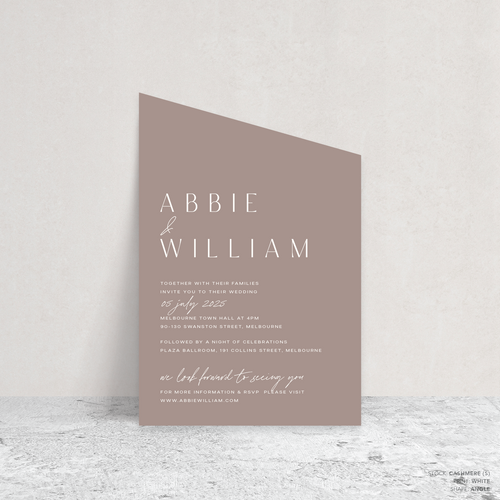 Angle shape flat lay of Abbie wedding invitation with clean, elegant layout and timeless typography, styled with a minimalist aesthetic.