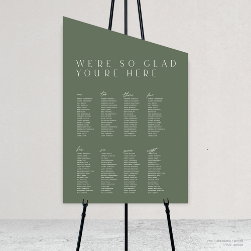 Angle shape flat lay of Abbie wedding seating chart with clean, elegant layout and timeless typography, styled with a minimalist aesthetic.