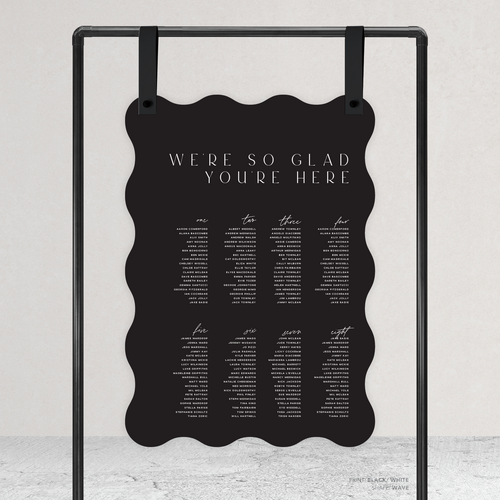 Wave shape flat lay of Abbie wedding seating chart with clean, elegant layout and timeless typography, styled with a minimalist aesthetic.