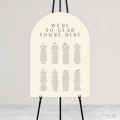 Arch shape flat lay of Abbie wedding seating chart with clean, elegant layout and timeless typography, styled with a minimalist aesthetic.