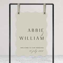 Wave shape flat lay of Abbie wedding welcome sign with clean, elegant layout and timeless typography, styled with a minimalist aesthetic.