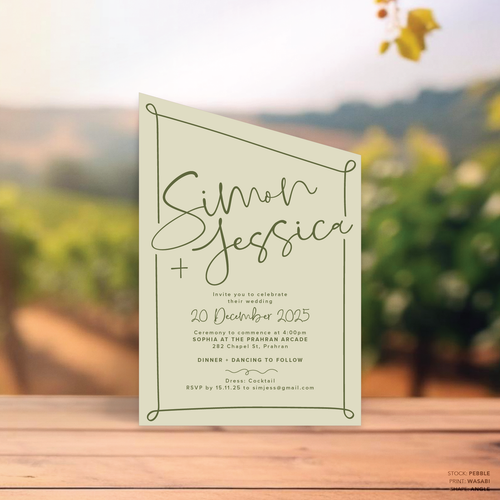 Angle shape flat lay of semi-custom Vino wedding invitation with hand-drawn vineyard-inspired border