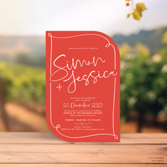 Double Up shape flat lay of semi-custom Vino wedding invitation with hand-drawn vineyard-inspired border