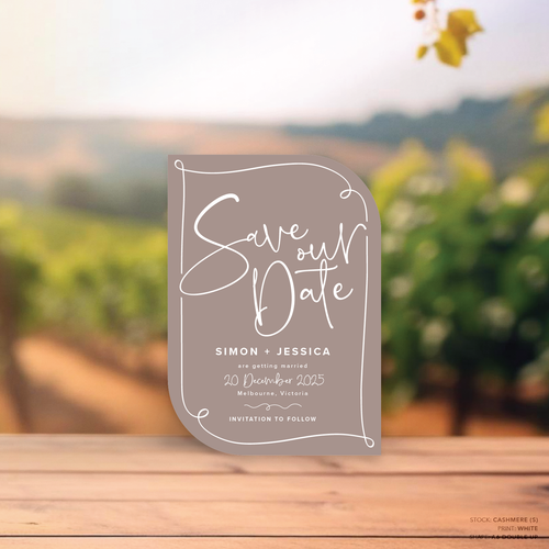 Double Up shape flat lay of semi-custom Vino wedding save the date with hand-drawn vineyard-inspired border.