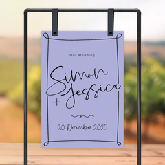 Rectangle shape flat lay of semi-custom Vino wedding welcome sign with hand-drawn vineyard-inspired border.