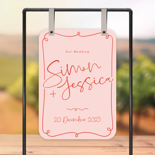 Round Corner shape flat lay of semi-custom Vino wedding welcome sign with hand-drawn vineyard-inspired border.
