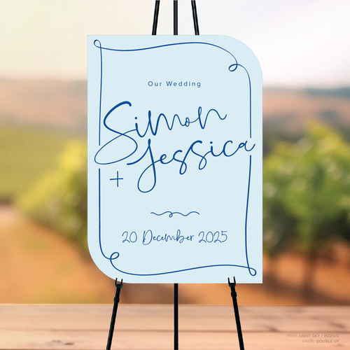 Double Up shape flat lay of semi-custom Vino wedding welcome sign with hand-drawn vineyard-inspired border.