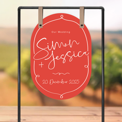 Double Arch shape flat lay of semi-custom Vino wedding welcome sign with hand-drawn vineyard-inspired border.