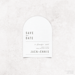 Arch shape flat lay of Never Let You Go wedding save the date featuring bold and delicate typography with modern, expressive layout and semi-custom design.