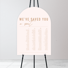 Arch shape flat lay of Never Let You Go wedding seating chart featuring bold and delicate typography with modern, expressive layout and semi-custom design.