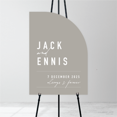 Sail shape flat lay of Never Let You Go wedding welcome sign featuring bold and delicate typography with modern, expressive layout and semi-custom design.